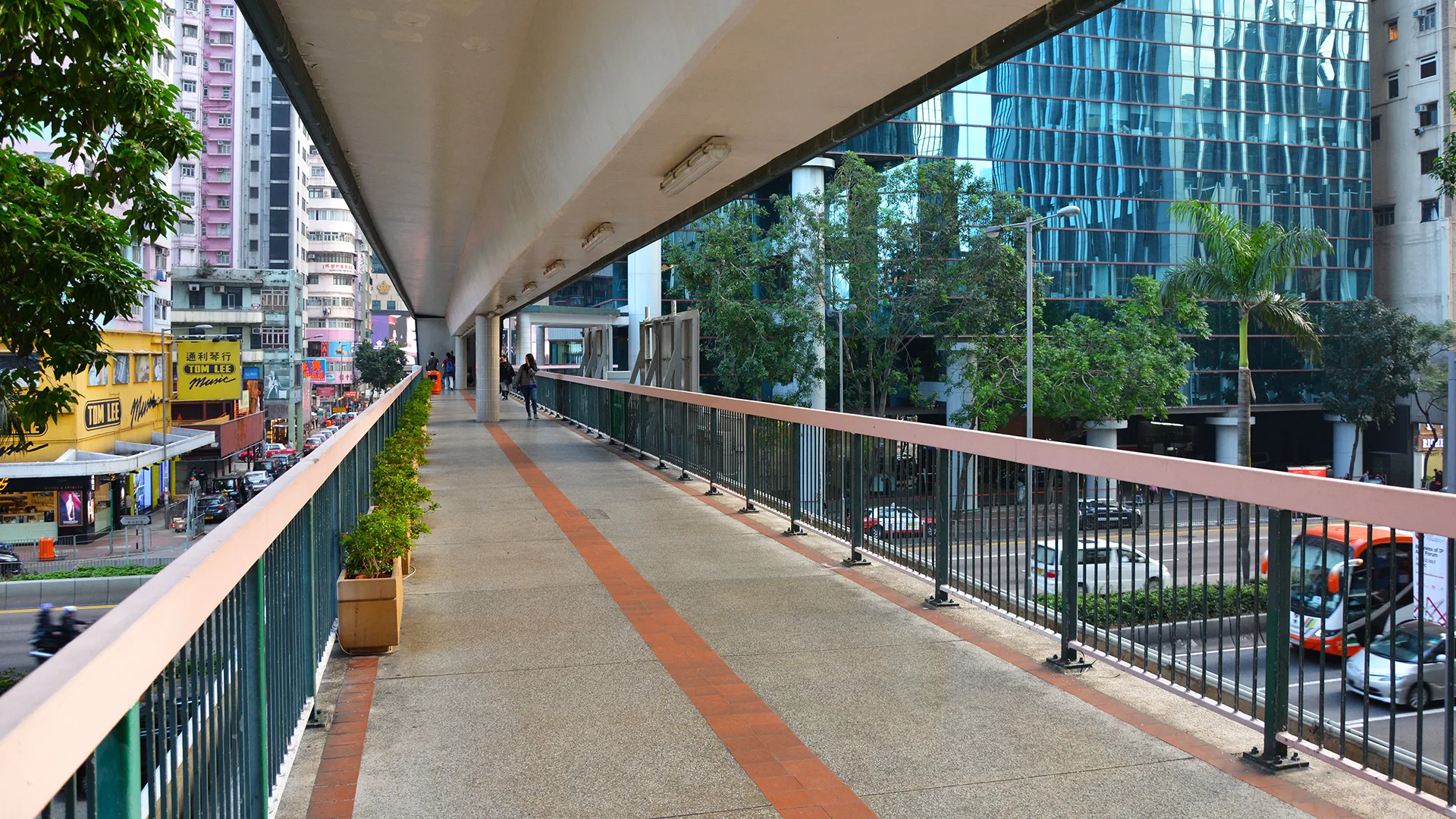 On Hong Kong Island it's common to separate vehicle traffic and pedestrians to such degree that many of the sidewalks go on bridges a few stories above street level, and in many cases you will also be led through buildings.