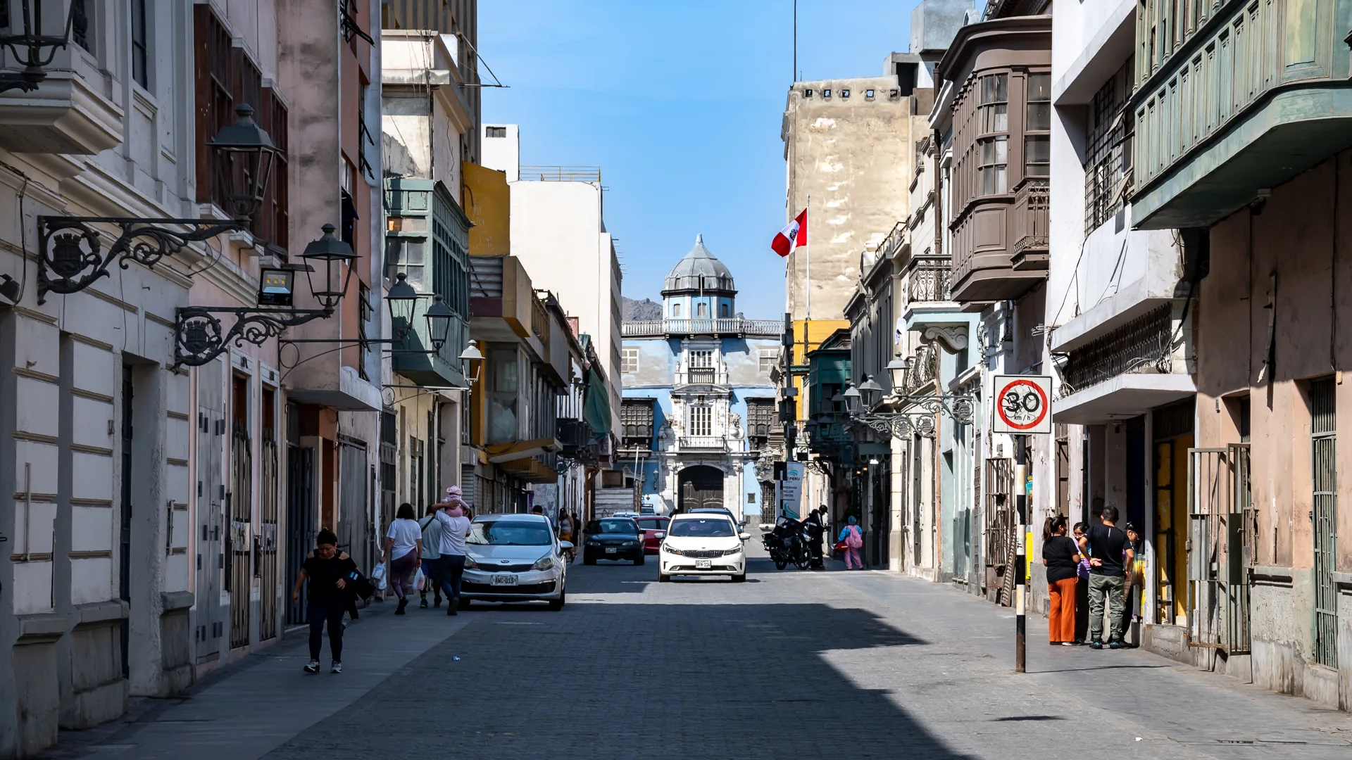 The Historic Centro of Lima with colonial balconies and Casa de Osambela at the end of the street