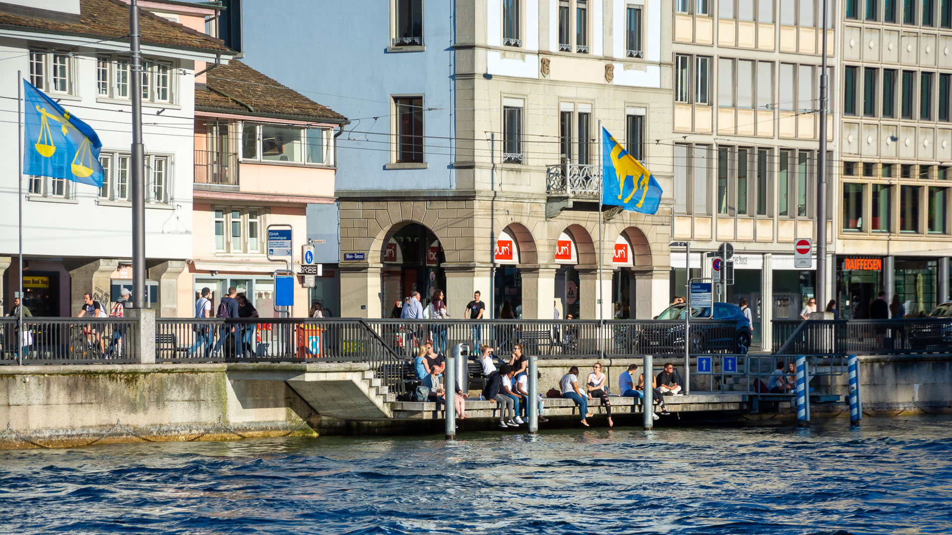 People relaxing along the Limmatquai